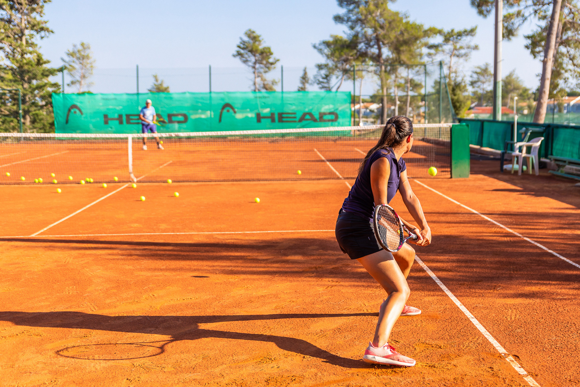 In-game moment on tennis court at Zaton Holiday Resort Zaton Holiday Resort