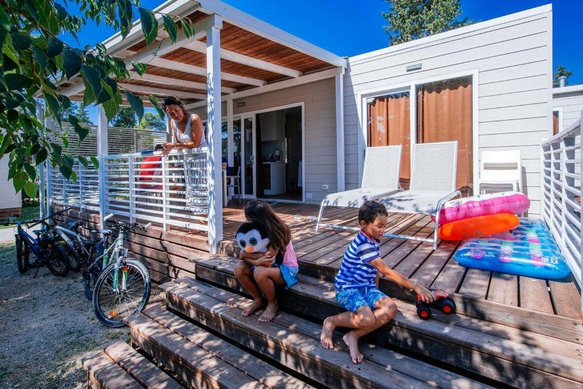 Enjoying family time on a terrace of a mobile home, Zaton Holiday Resort