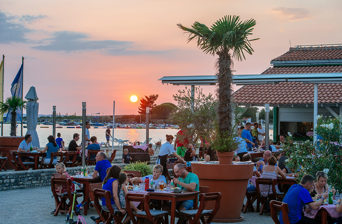 Enjoying a lovely meal with a sea view at sunset at Pizza & Grill More, Zaton Holiday Resort