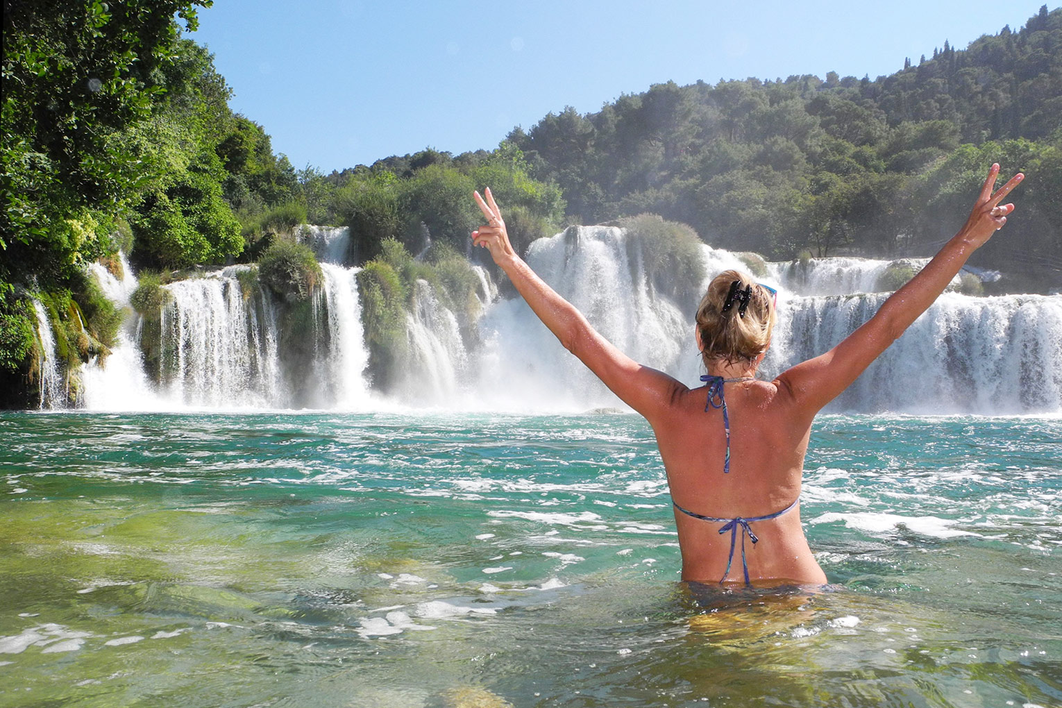 Swimming by Skradinski buk waterfall in Krka National Park